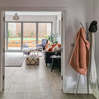 Wooden LVT flooring in a bathroom with an elegant stainless steel bath tub